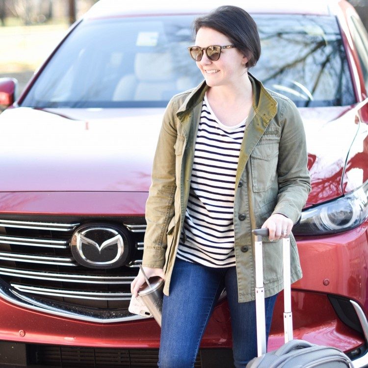 love this casual outfit for a road trip - striped tee, olive green jacket, dark jeans