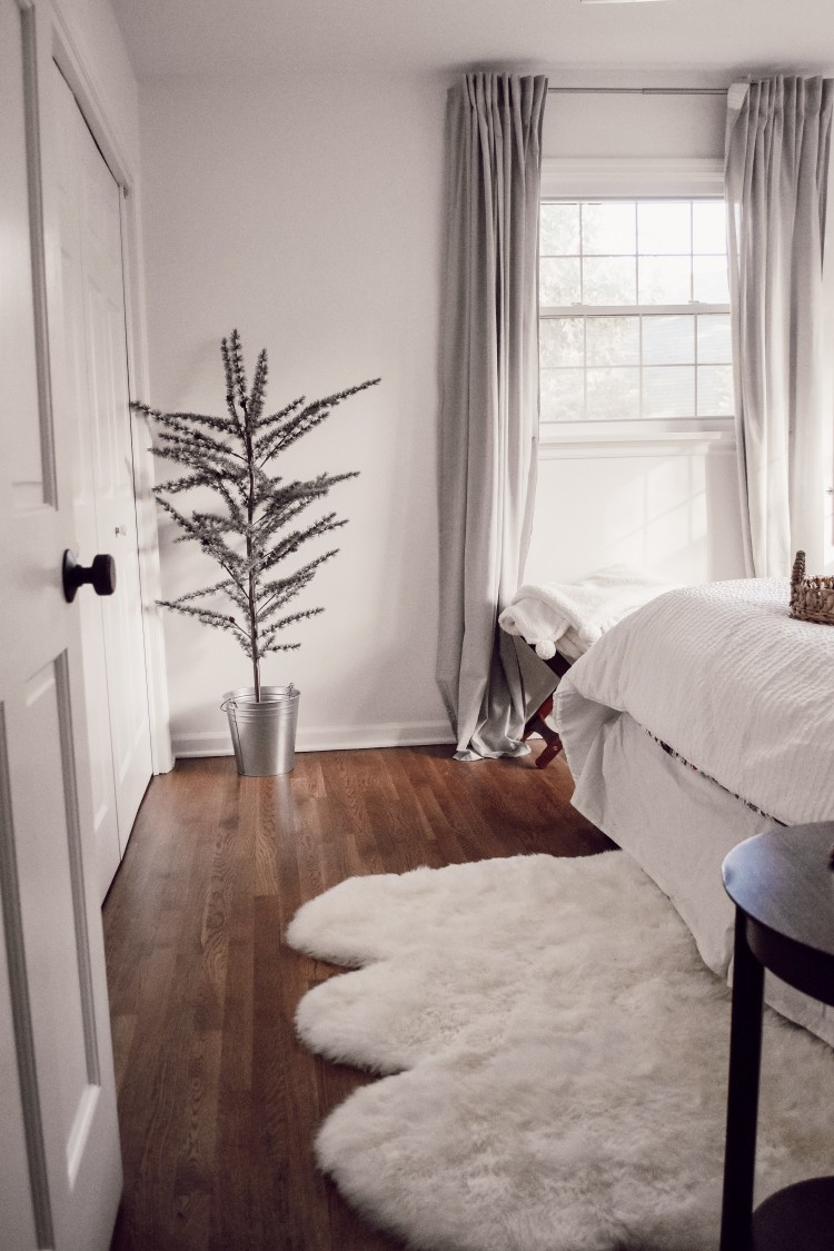 obsessed with this fake christmas tree from ikea plus a faux fur rug 