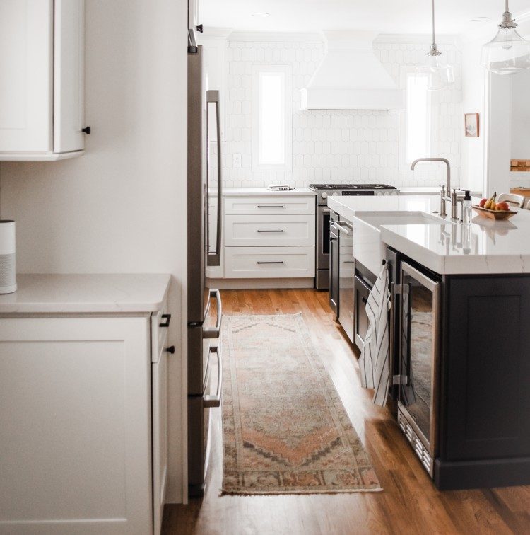 white kitchen with white farmhouse sink