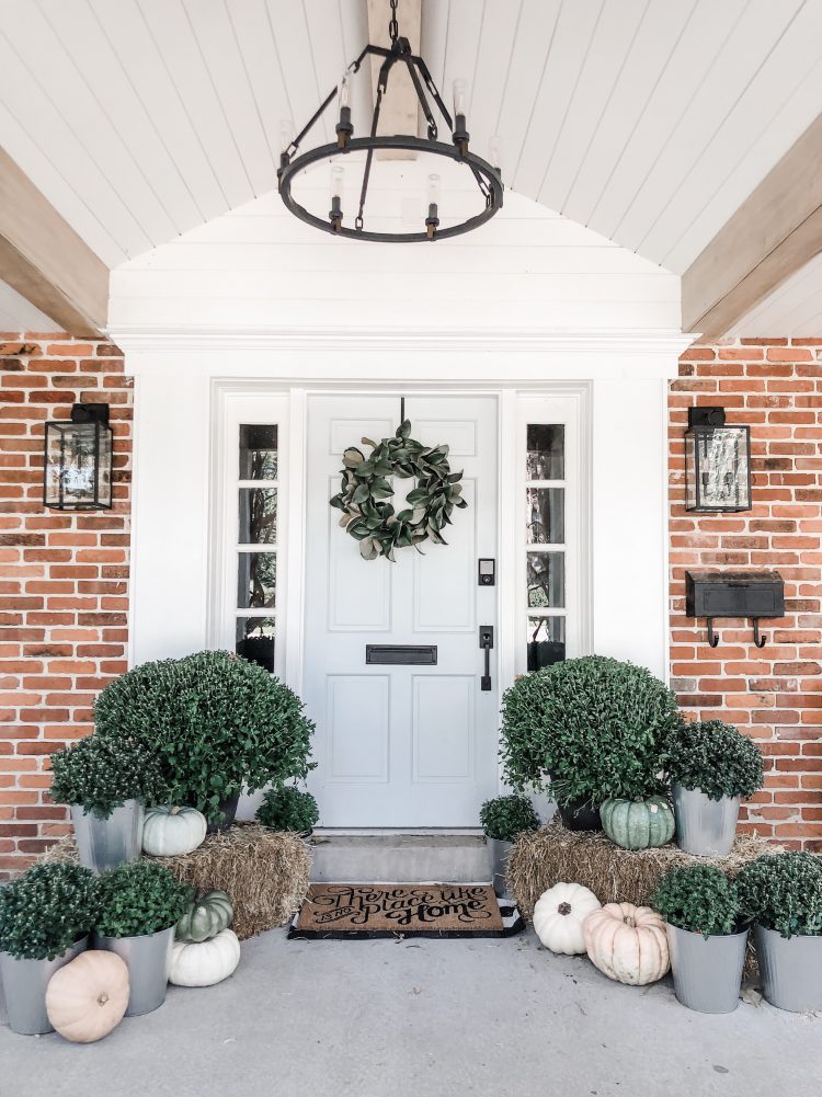 fall front porch with mums and pumpkins